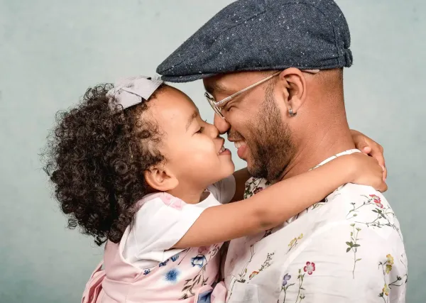 A father and daughter sharing a tender moment